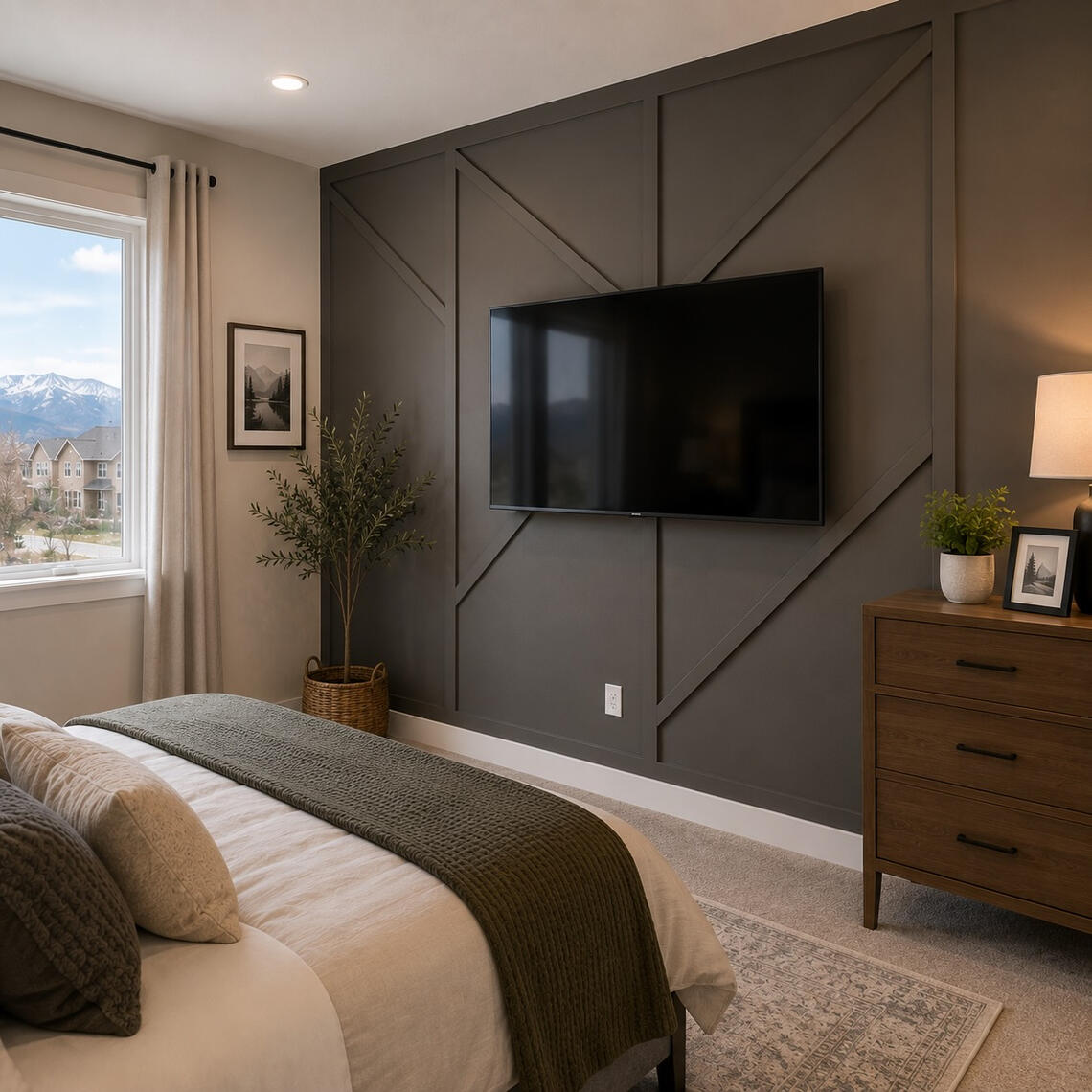 Modern geometric accent wall with mounted TV in a Phoenix bedroom Modern geometric accent wall with mounted TV in a Phoenix bedroom